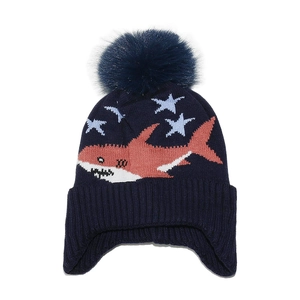 Detail view of navy blue knitted shark hat with large pompom and warm ear flaps
