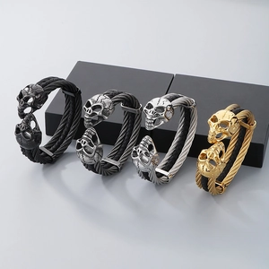 Men's double-wrap punk skull bracelets in black, silver, and gold finish stainless steel