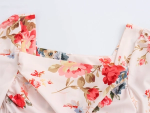 Close-up of floral print long dress showing square neckline and soft crepe texture