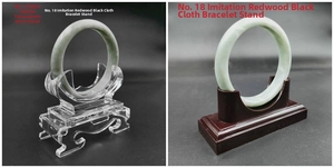 Detail view of acrylic horn-shaped and faux mahogany jade bracelet display stands