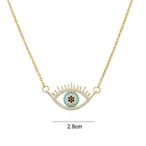 Detail showing the 2.8cm evil eye pendant with micro-inlaid cubic zirconia on a gold chain