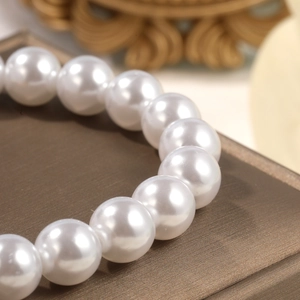 Macro detail of high-quality Baroque white pearls with elegant glossy finish and texture