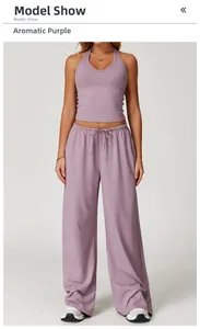 Detail of lavender yoga set featuring a halter crop top and high-waisted wide-leg pants