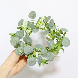 Artificial eucalyptus wreath with white baby's breath flowers and rustic burlap bow