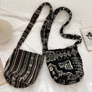 Flat lay of plush leopard pattern and geometric totem bucket bags for autumn winter