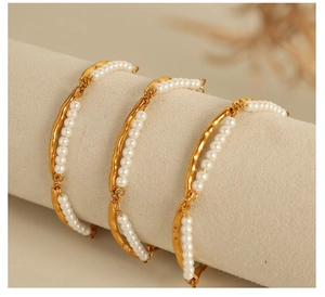 Detail of double-layer pearl and 18K gold-plated stainless steel bracelet on display