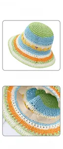 Detail view of colorful woven straw sun hat with adjustable inner strap and breathable texture