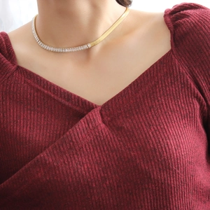 18k gold plated snake chain necklace with rectangular zircons on female model
