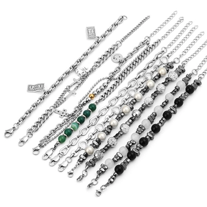 Set of 10 gold-plated stainless steel chain and beaded bracelets with mixed charm pendants