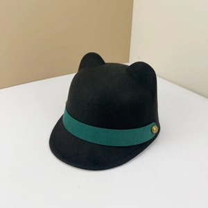 Detailed view of children's cat ear felt hat with green band and brass rivet accents