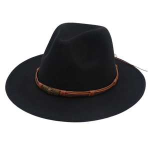 Detail of black felt fedora hat featuring brown braided band and bronze skull ornament