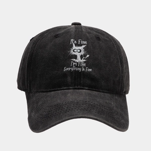 Detail of washed black baseball cap with distressed cat print and sarcastic text