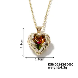 Detail of gold heart pendant with multicolor zircon inlay and 1.6cm size measurement