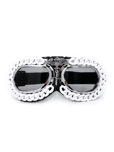 Macro detail of gothic steampunk goggles with silver dragon emblem and white chain