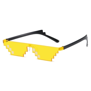 Detail of retro mosaic square sunglasses with translucent yellow lenses and black frame