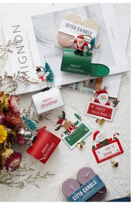Festive Christmas mailbox and santa hanging ornaments on a cozy textured background