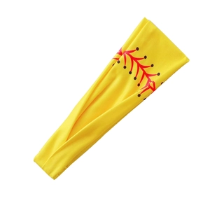 Detail view of the yellow elastic sports headband with red baseball stitching pattern