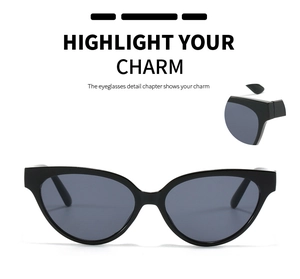 Detail view of black small square cat eye sunglasses with dark lenses for women