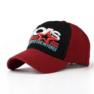 Close-up of red and black cotton baseball cap with 1915 star embroidery and eyelets