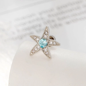 Silver starfish cartilage earring with blue heart gemstone and micro-pave zircons