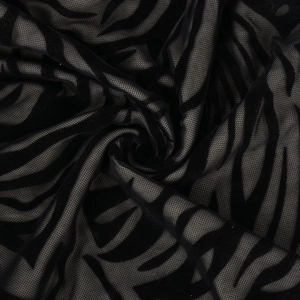Texture détaillée du tissu en maille floquée noire avec motifs abstraits pour robes sexy