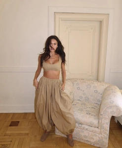Close-up of khaki three-piece set featuring cropped tank top and loose lantern trousers