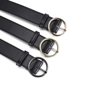 Three minimalist black PU leather belts featuring gold, bronze, and black round metal buckles