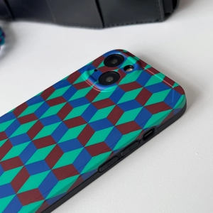 Detail of blue and burgundy geometric woven strap on a silicone case for iPhone