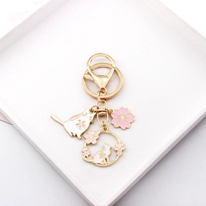 Cute Japanese style cat and cherry blossom keychain bag pendant with lovely pink enamel.
