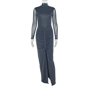 Detail of black high neck dress with mesh sleeves and side slit pleated hem design