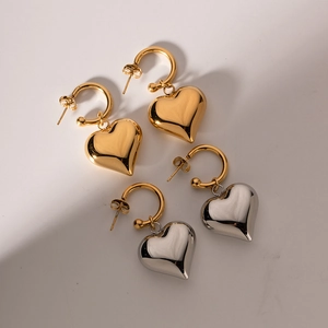Chic gold and silver heart hoop earrings in stainless steel with polished finish