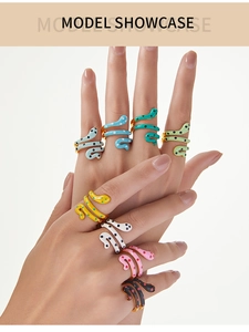 Model showcasing colorful snake rings with multi-color enamel coating and gold accents