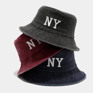 Washed cotton bucket hats in dark grey, burgundy, and navy with white NY embroidery