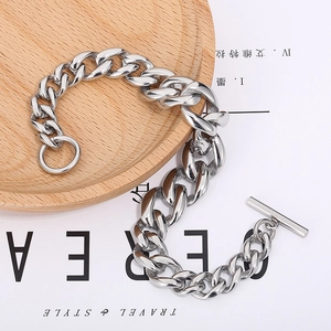 Detail of heavy stainless steel Cuban chain bracelet with vintage OT toggle clasp