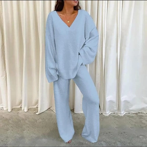 Close-up of light blue flannel lounge set featuring V-neck long sleeves and wide-leg pants