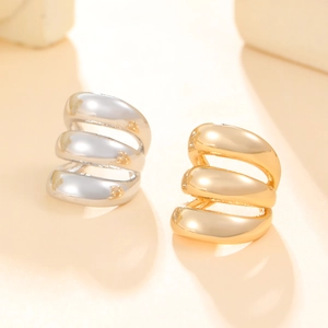 Minimalist triple-layer wrap ear cuff in polished gold and silver finishes