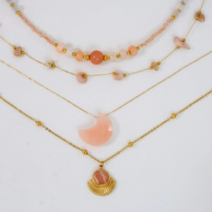 Detail of multi-layered 14K gold plated necklace with moon and fan pendants and sunstones