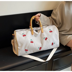 Minimalist cream canvas crossbody bag with red cherry embroidery and yellow handles