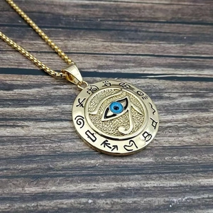Golden Egyptian Eye of Horus medallion pendant on a square pearl chain with blue enamel eye