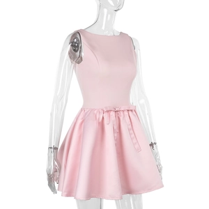 Detail of pink satin dress featuring a sleeveless design and delicate waist bow decoration