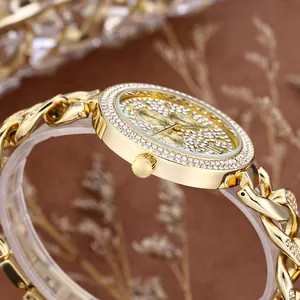 Golden hip hop watch with chain link strap and iced out crystals for men in close-up view