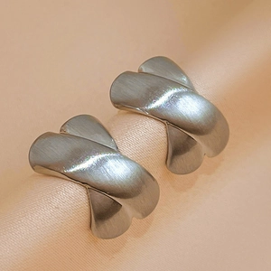Minimalist matte silver X-shaped cross stud earrings with a brushed metal texture