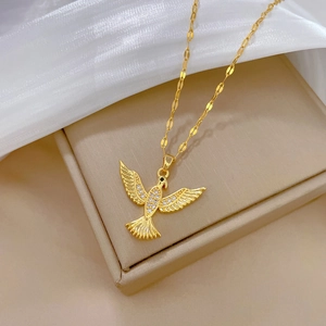 Gold-plated flying bird pendant necklace with sparkling diamonds on elegant chain