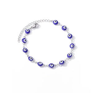 Detail view of Evil Eye charm bracelet with blue enamel beads and lobster clasp