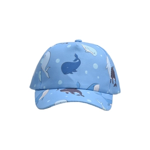 Close-up of light blue kids baseball cap with cartoon whale and dolphin prints