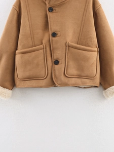 Detail of tan suede jacket featuring white faux fur lining and large side pockets