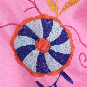 Pink cotton linen cardigan with colorful windmill embroidery details and vibrant textures
