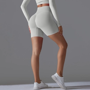 Close-up of seamless grey yoga set featuring high-waisted shorts and crop top