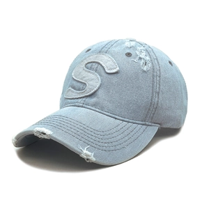 Distressed light blue denim baseball cap featuring white S letter patch and frayed edges