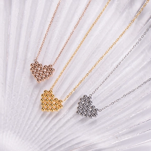 Detailed comparison of beaded heart pendants in rose gold, gold, and silver finishes